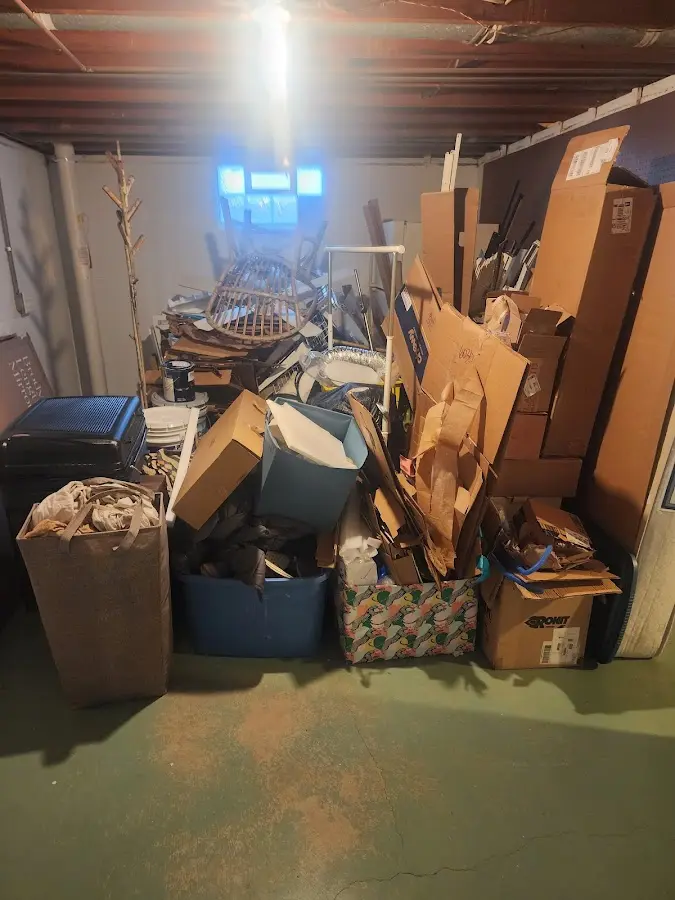 Roll-off dumpster container at job site for 2 Yard Dumpster Rental in Great Neck